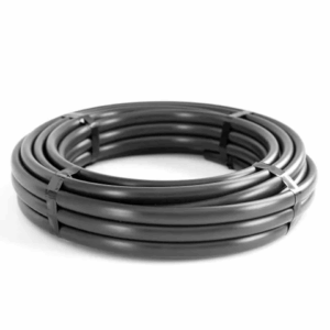 Coiled black plastic irrigation tubing secured with ties